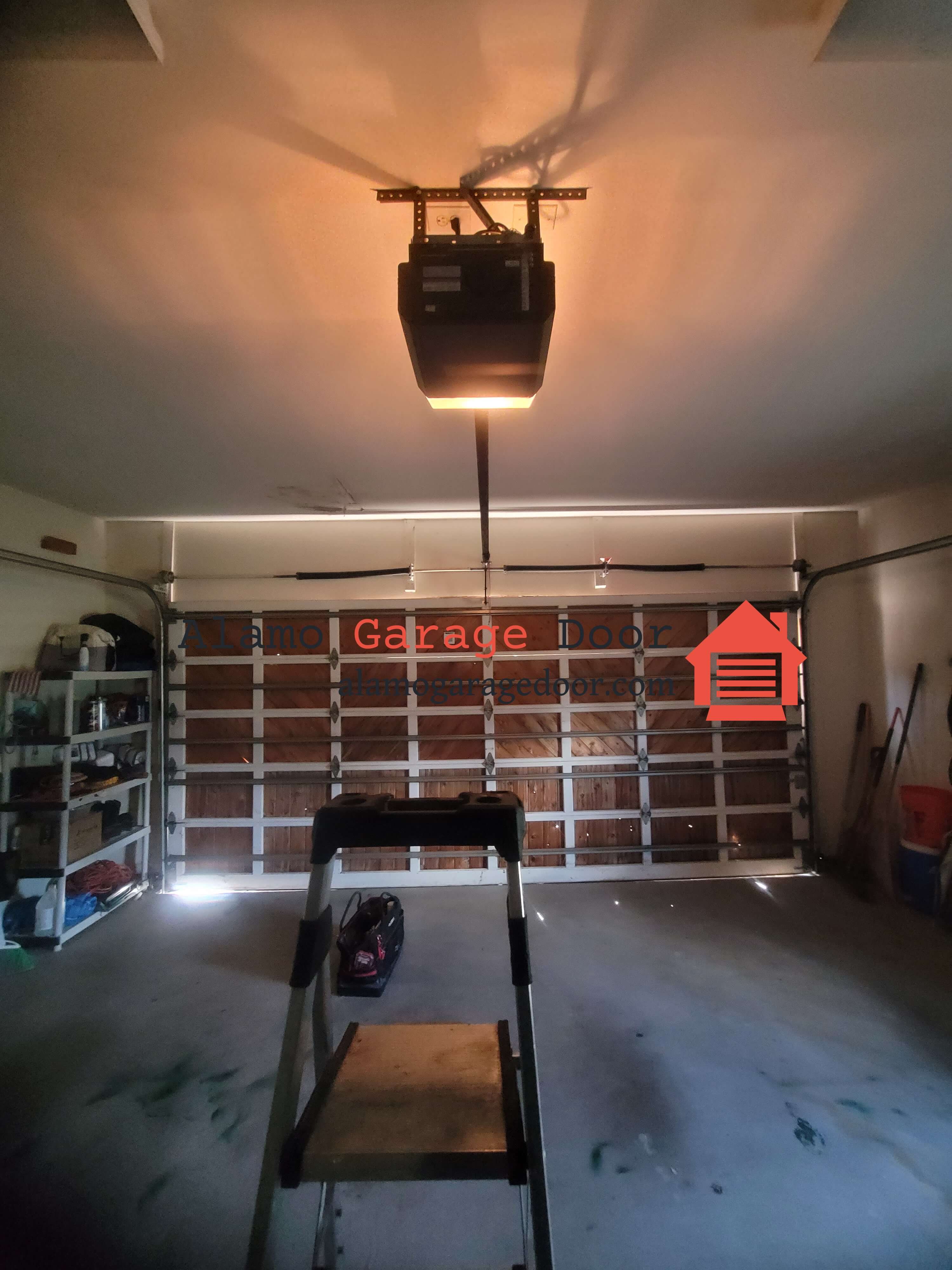 alamogaragedoor.com_wood_garage_door_torsion_spring_replacement